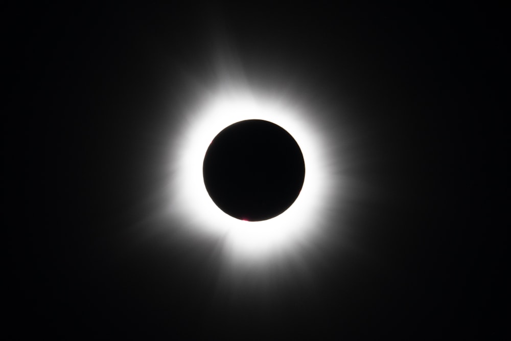 a solar eclipse is seen in the dark sky