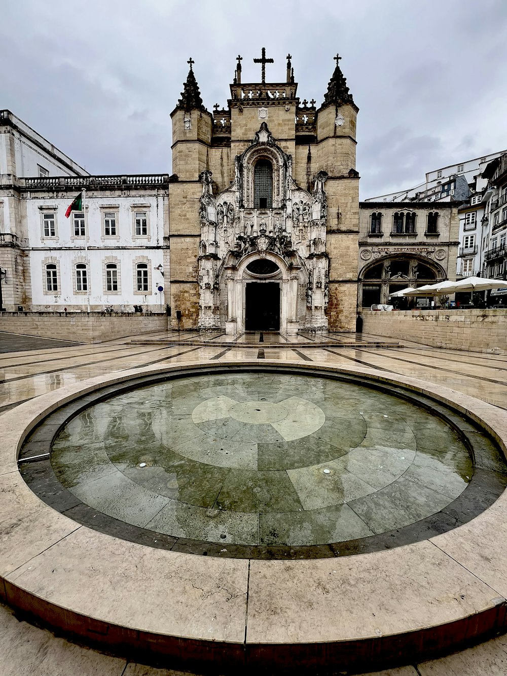 a large building with a fountain in front of it