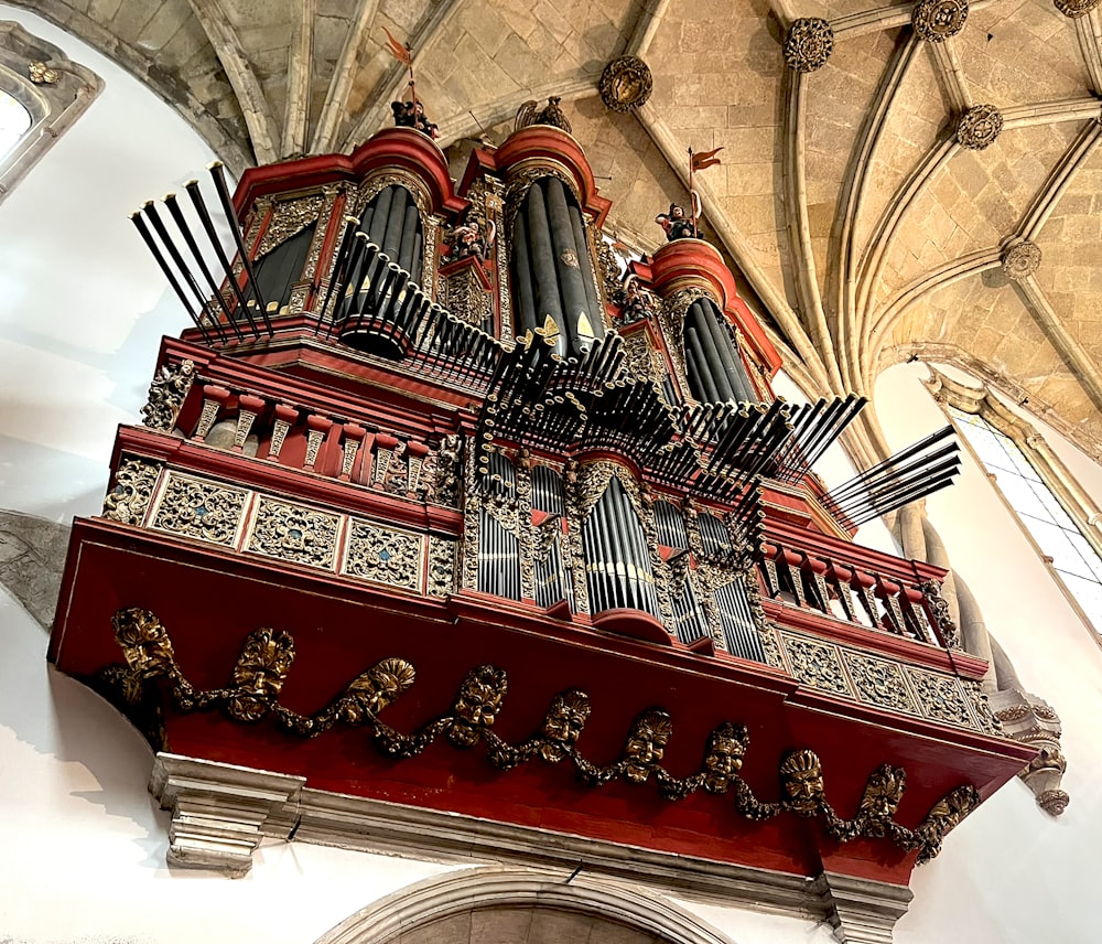 a pipe organ in a church with a vaulted ceiling