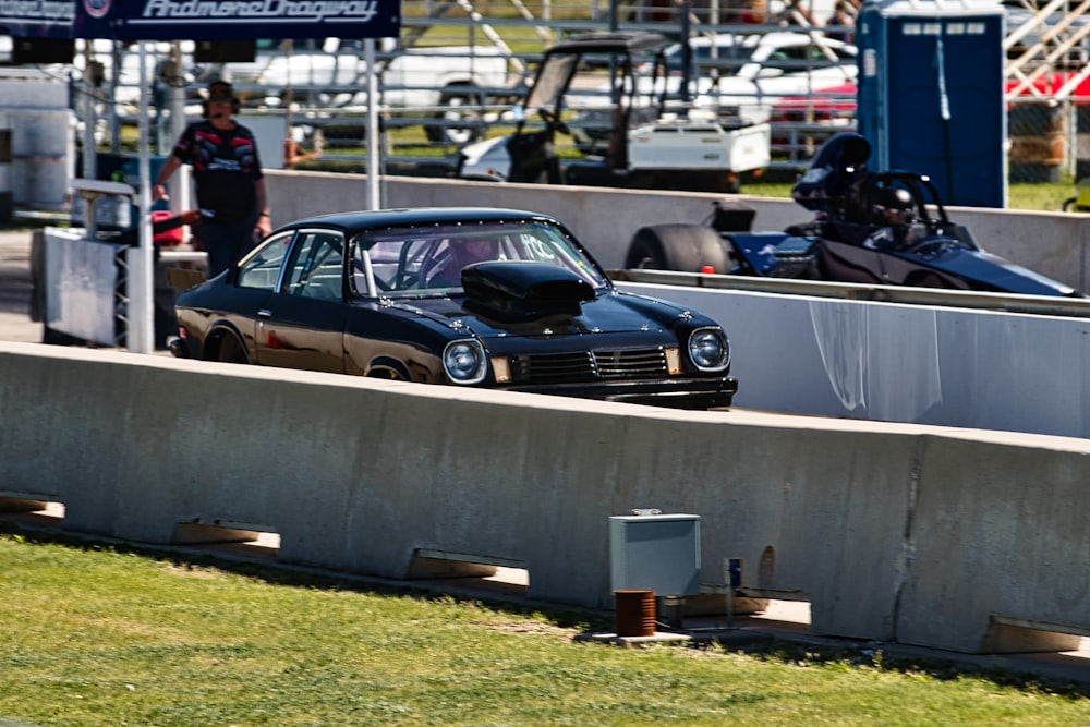 a small car is driving around a track