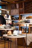 Retail store interior with merchandise displayed on shelves and tables