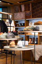 Retail store interior with merchandise displayed on shelves and tables