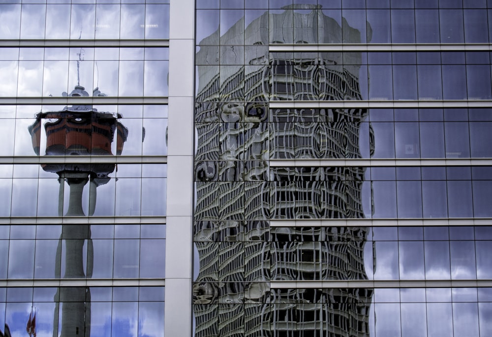 the reflection of a building in the windows of another building