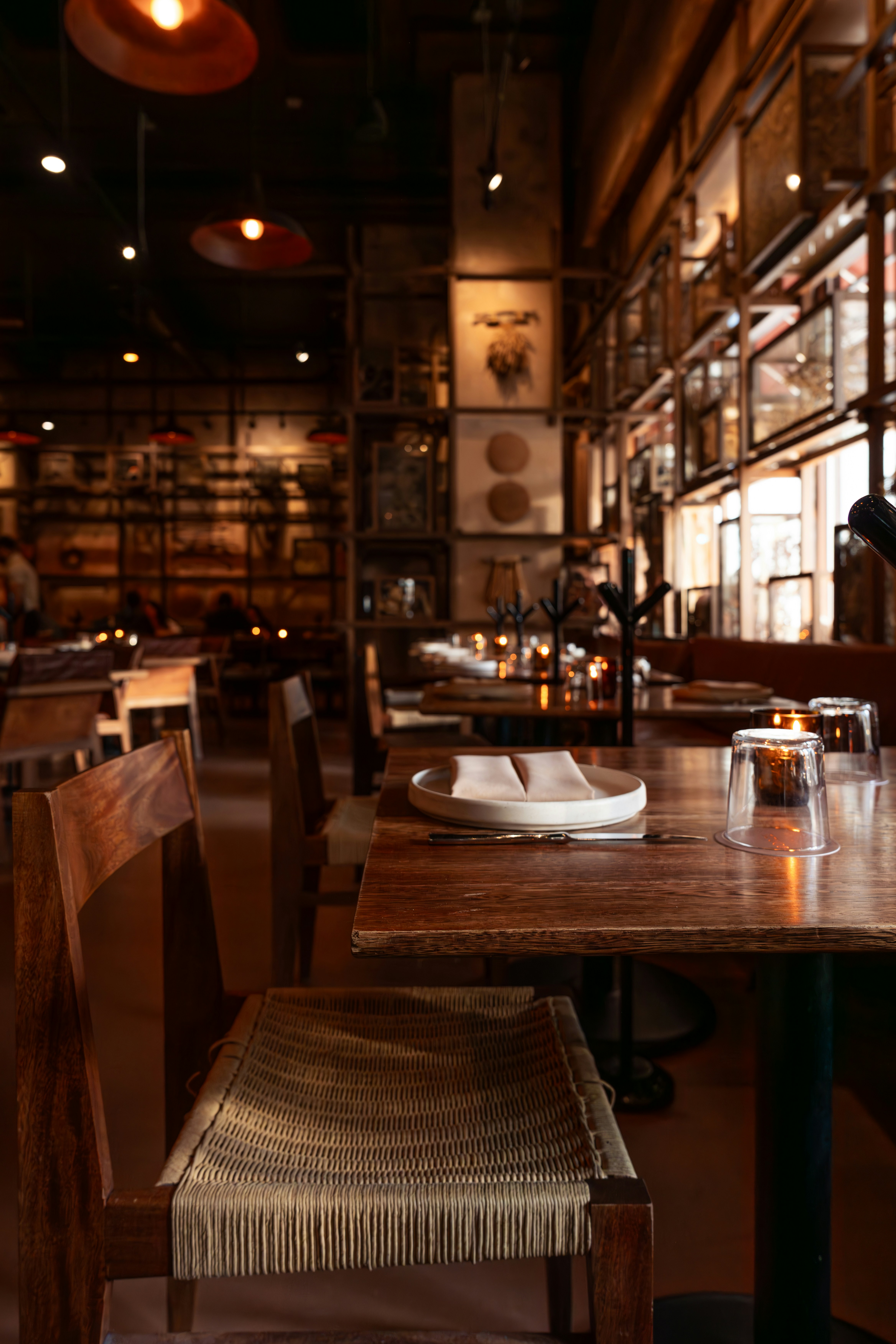 a wooden table with a white plate on top of it