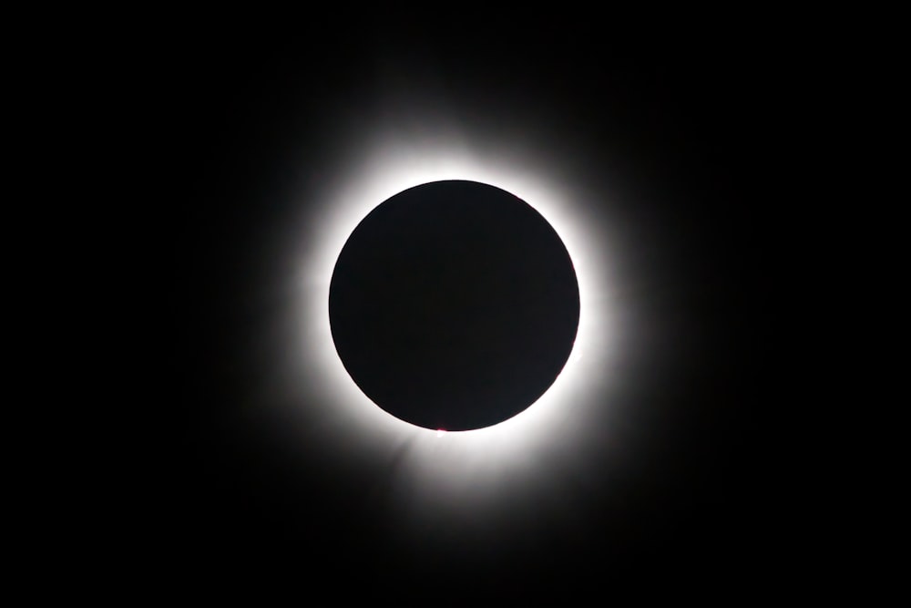 a solar eclipse is seen in the dark sky