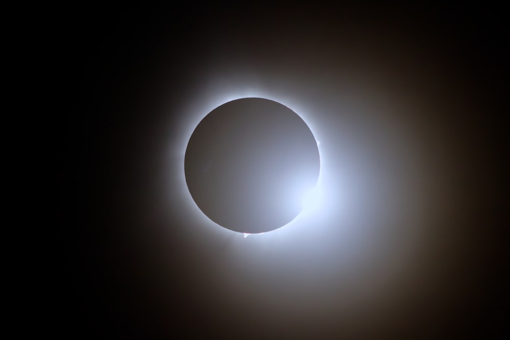 a solar eclipse in the dark sky