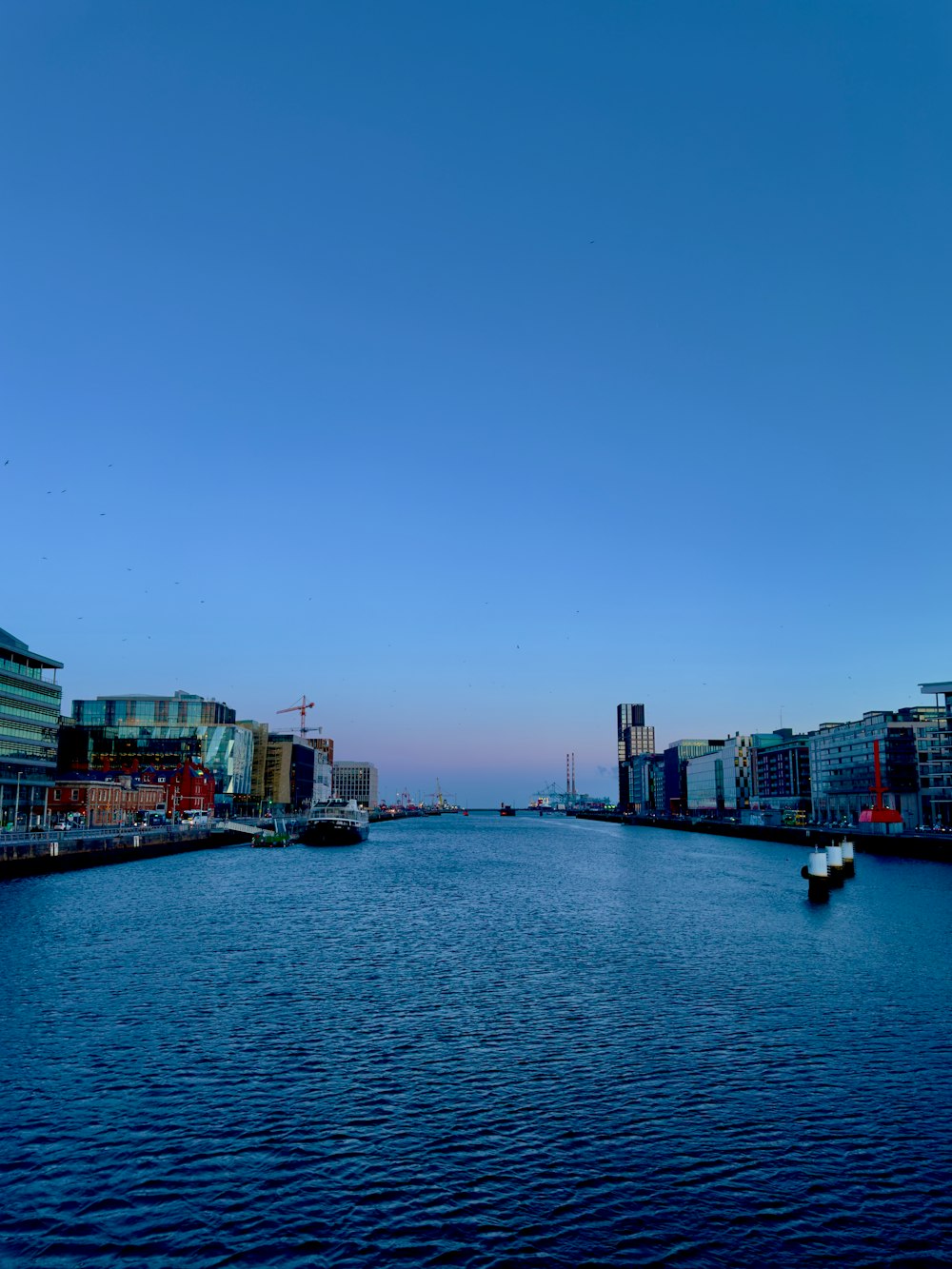 a body of water surrounded by tall buildings