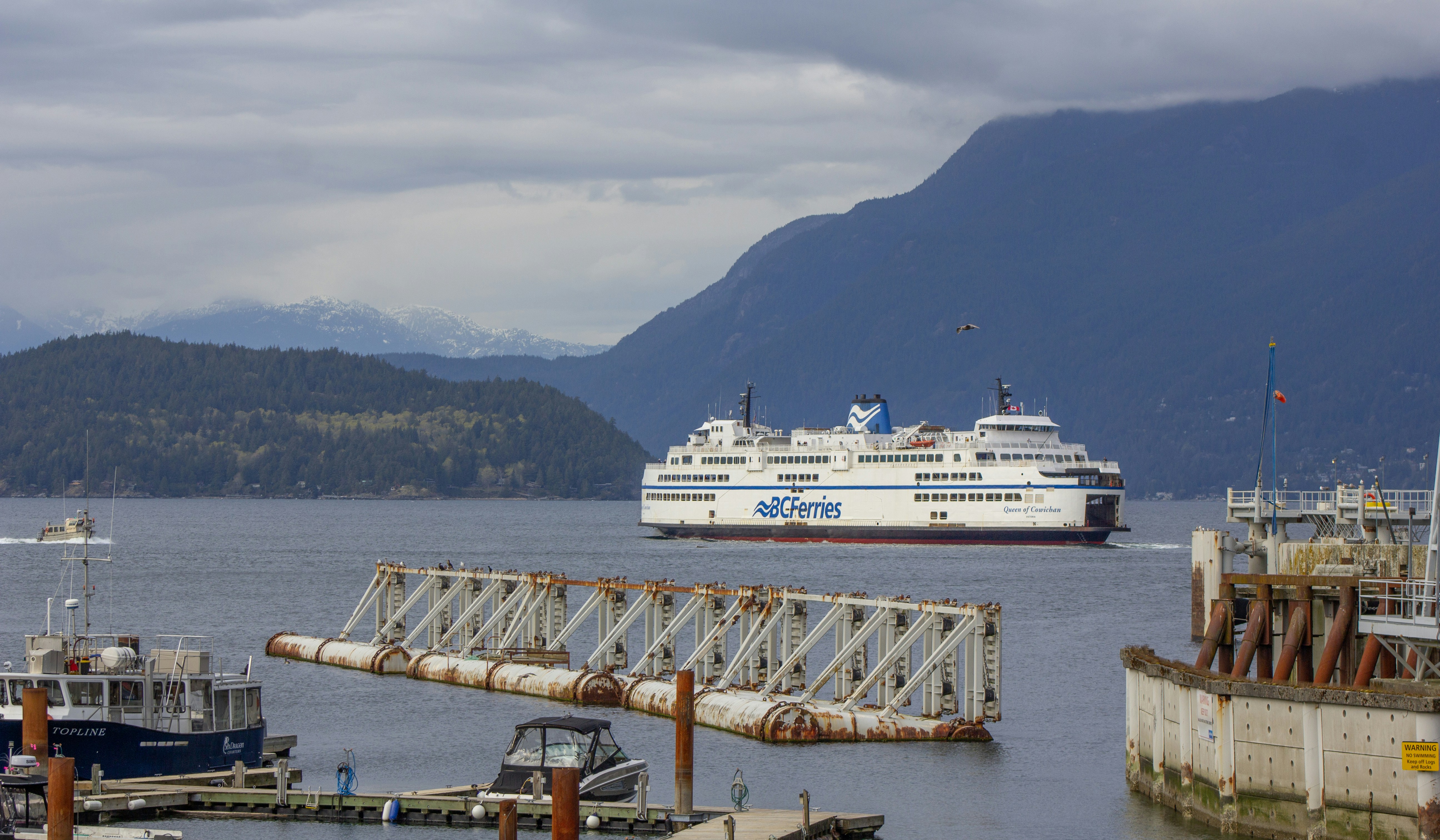 a cruise ship in the water near a dock