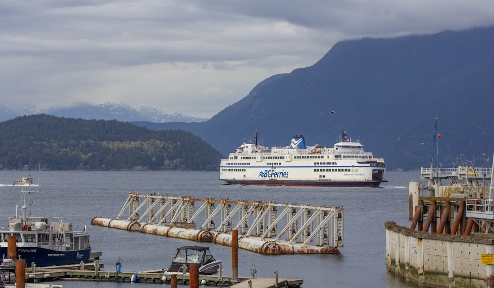 a cruise ship in the water near a dock