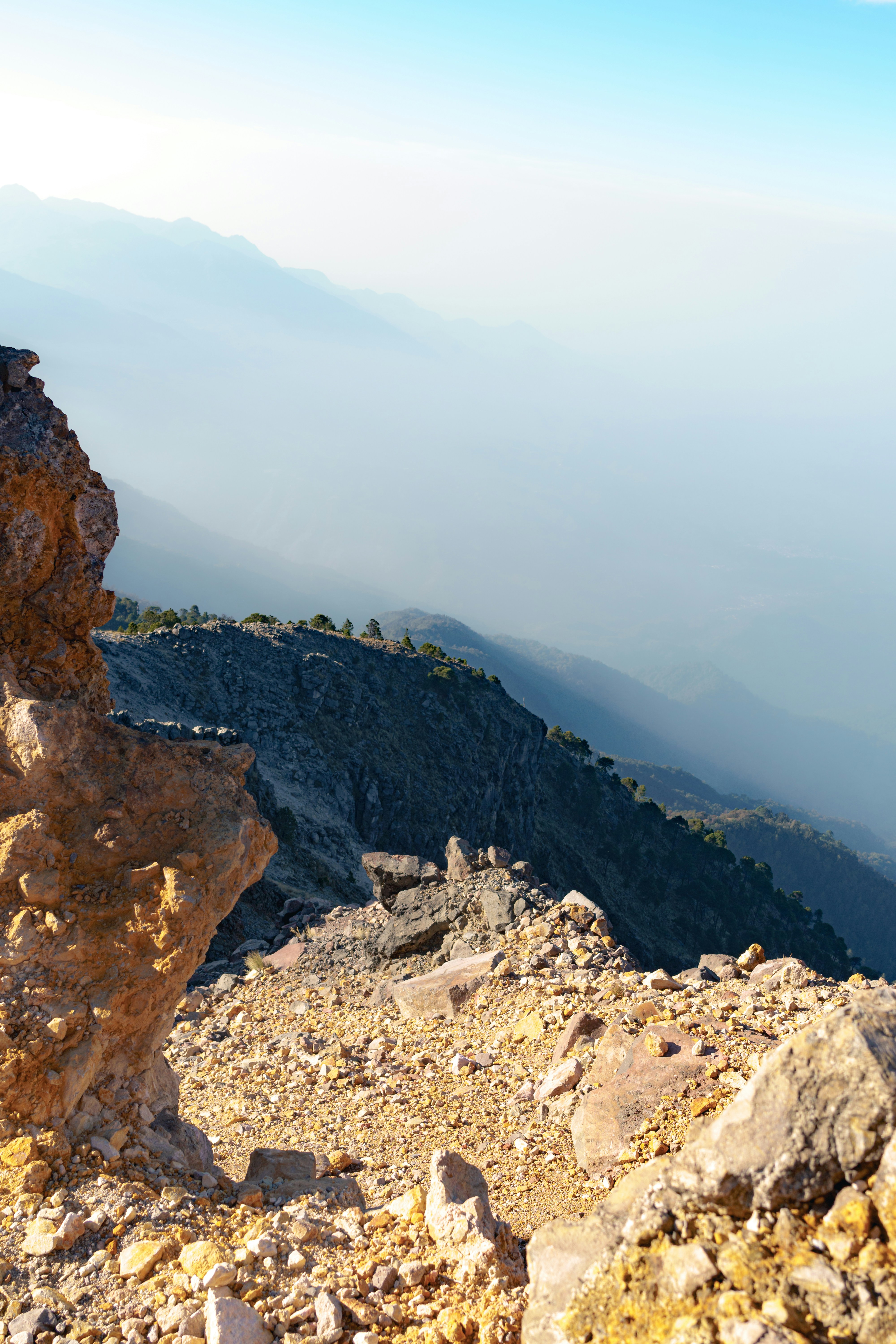 a large rock sitting on top of a mountain