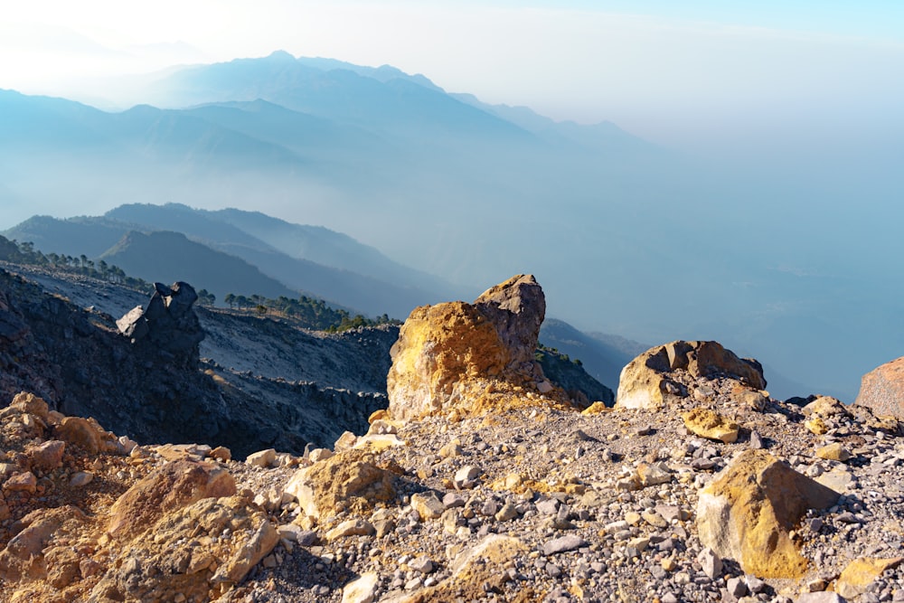 a view of a rocky mountain range with mountains in the background