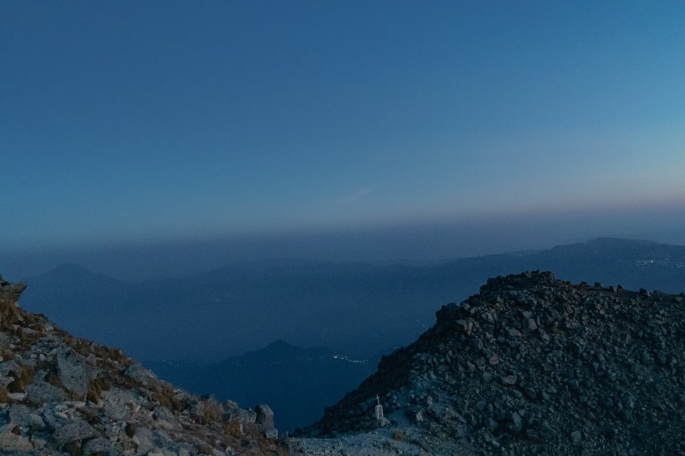 a man standing on top of a rocky mountain