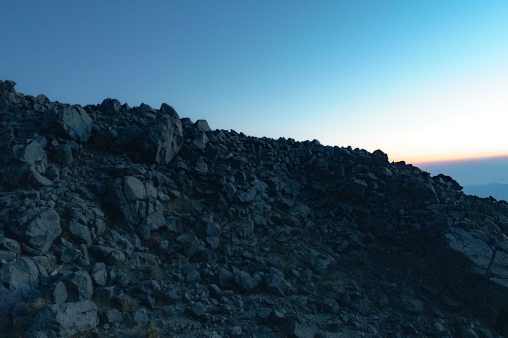 a man standing on top of a rocky mountain