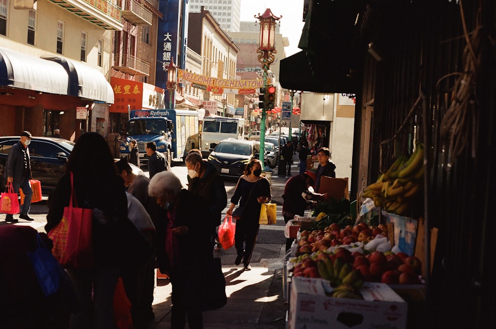 a group of people walking down a street