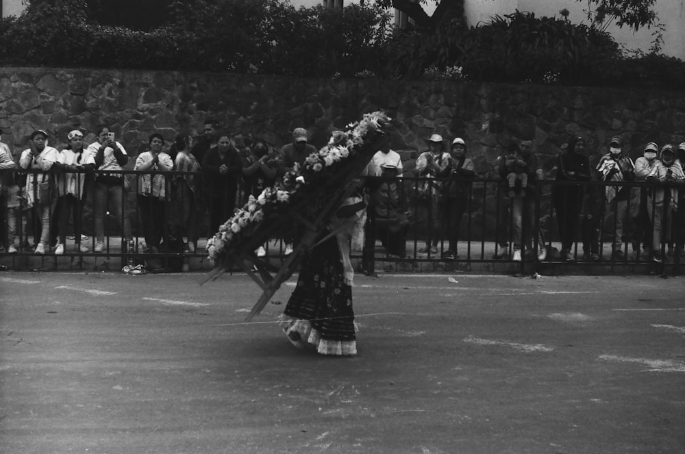 a black and white photo of a woman performing a dance