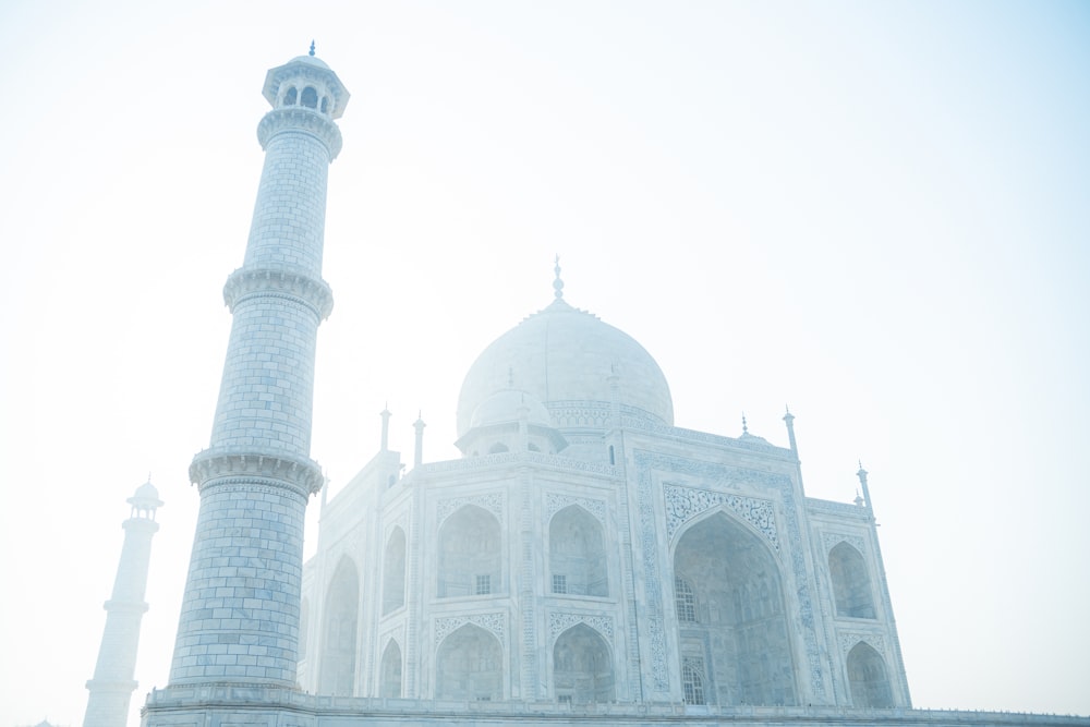 a large white building with a tall white tower