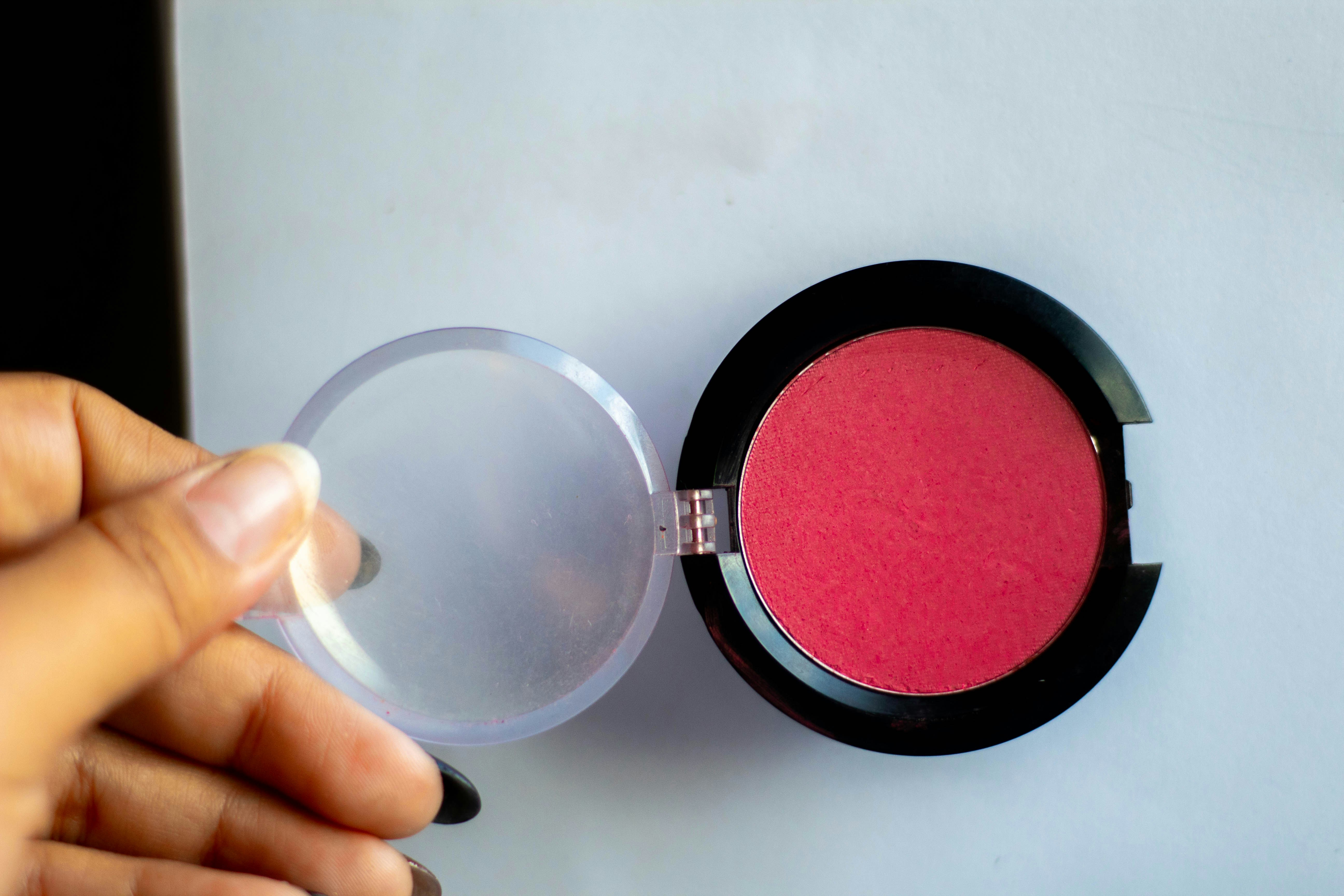 a person holding a compact compact compact compact compact compact compact compact compact compact compact compact