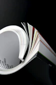 a close up of an open book on a table