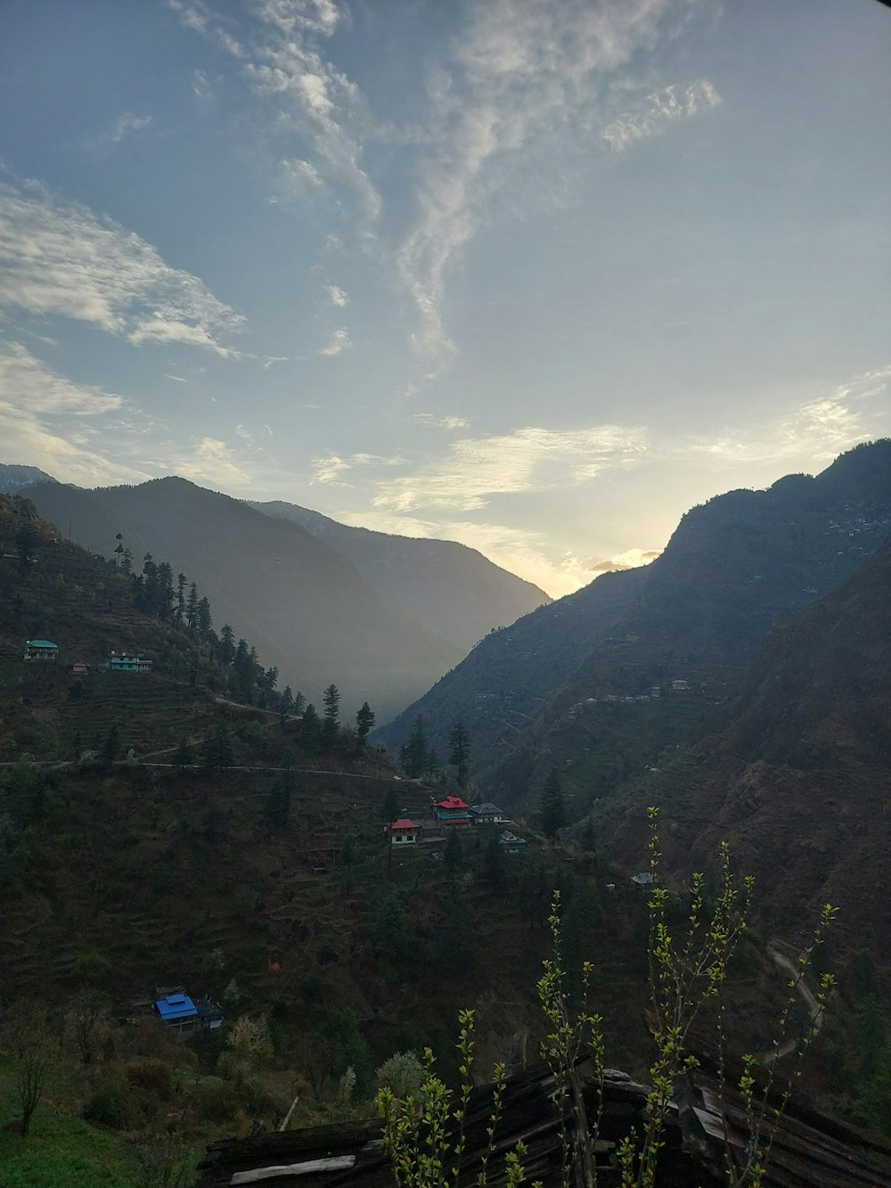 a view of a valley with mountains in the background