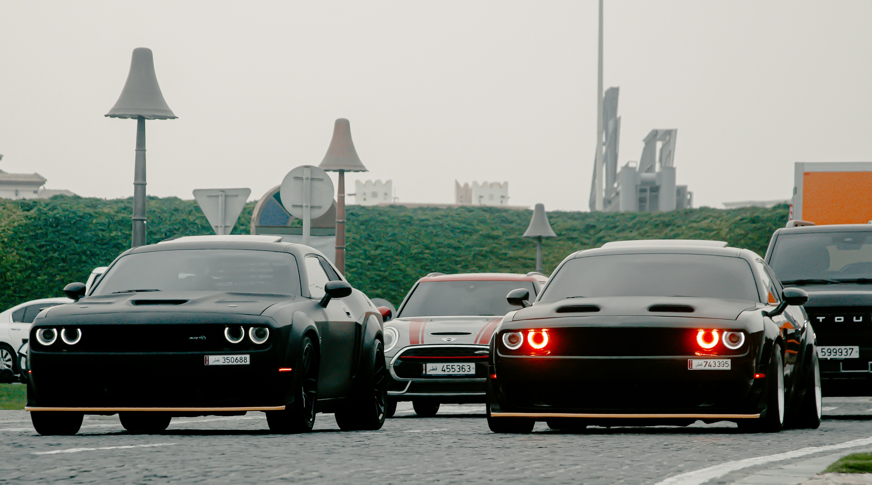 a group of cars that are sitting in the street