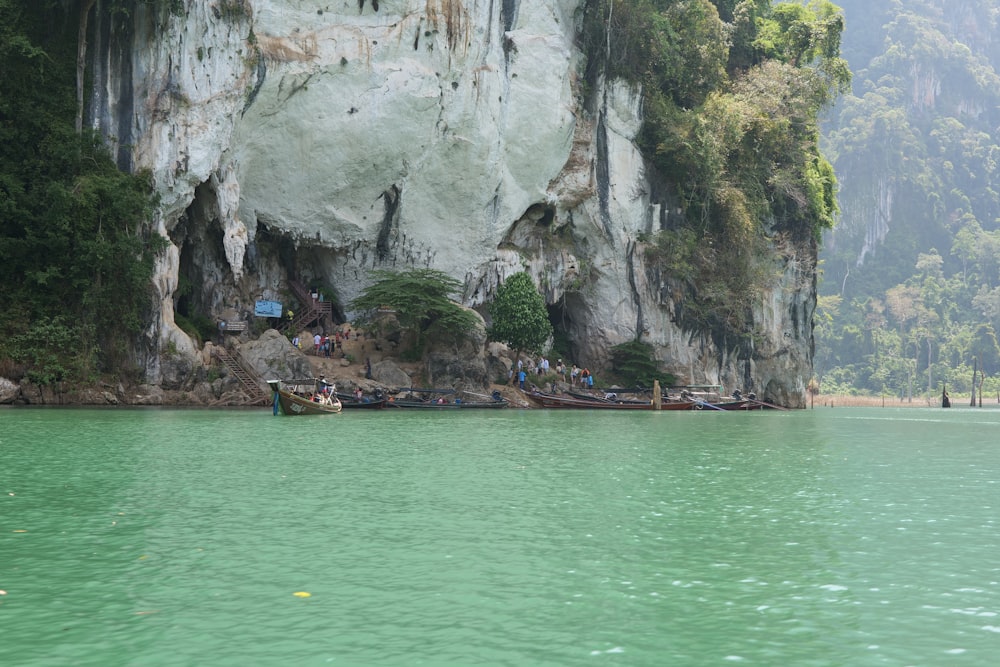 a body of water with a mountain in the background