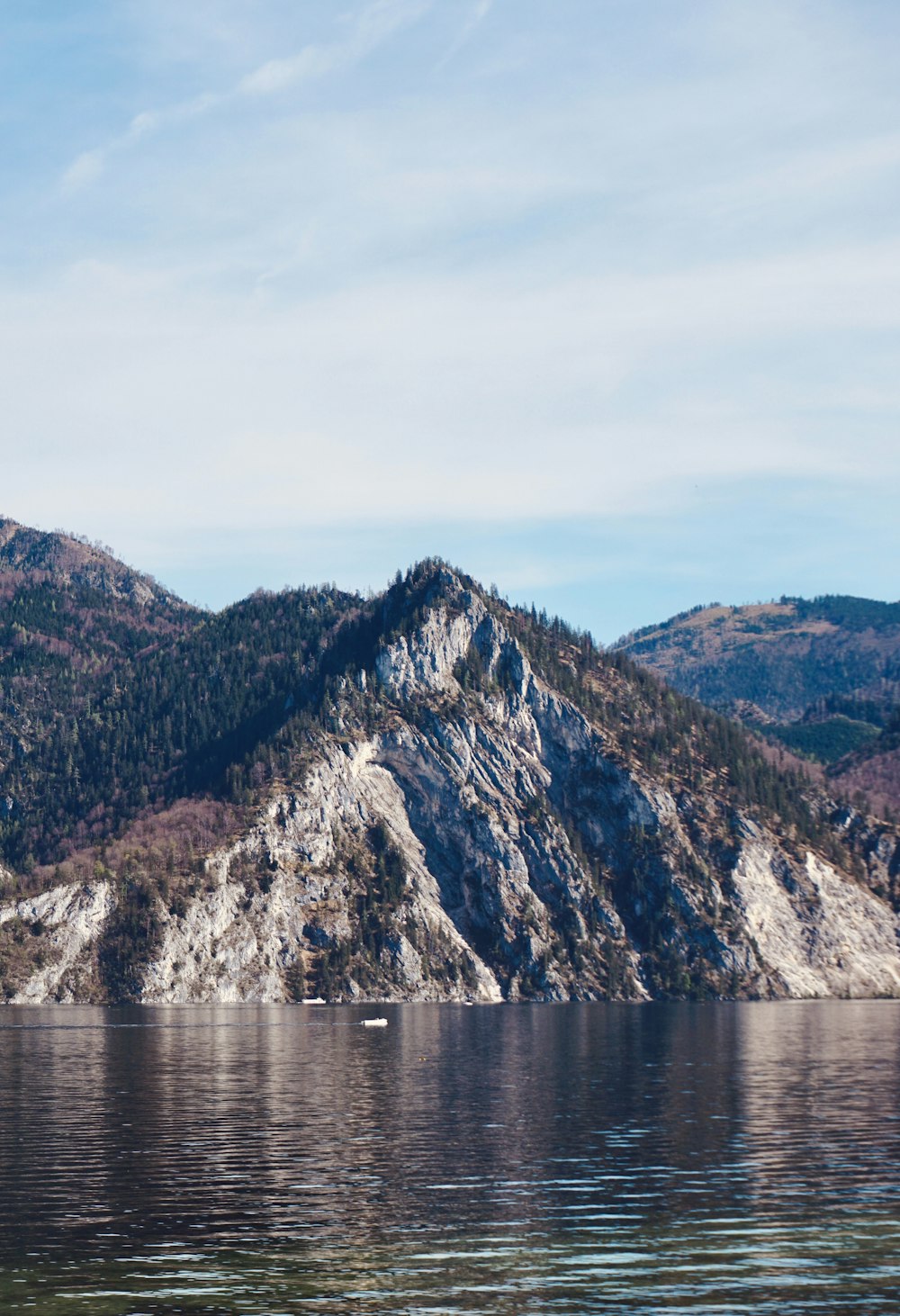 a mountain with a body of water in front of it