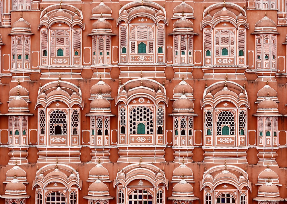 a very tall building with many windows and balconies