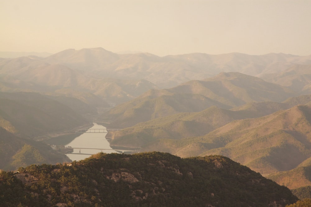 a view of a river in the middle of a mountain range