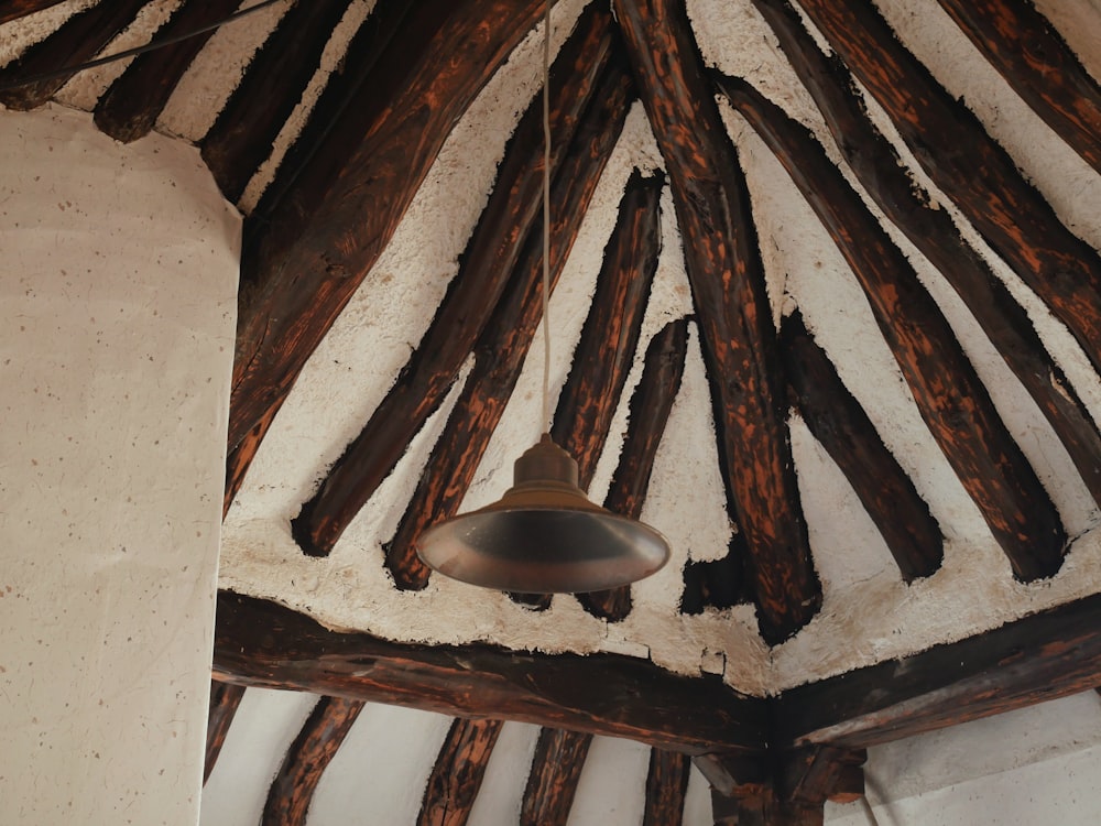 a bell hanging from the ceiling of a building