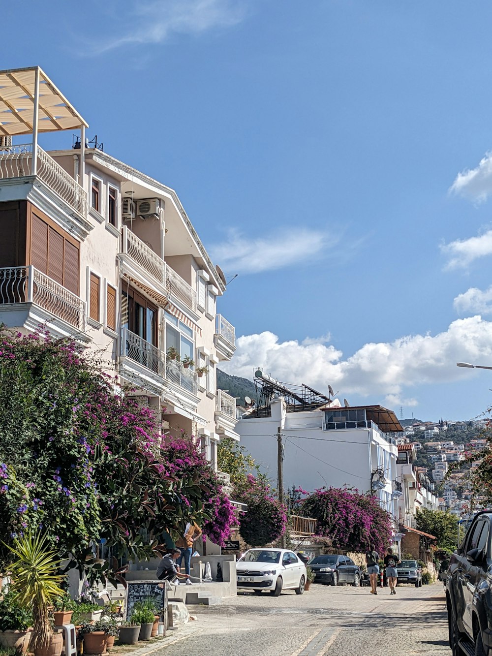 a street with cars parked on the side of it