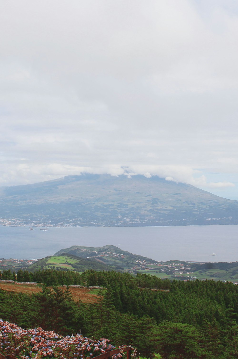 a view of a mountain with a lake in the background