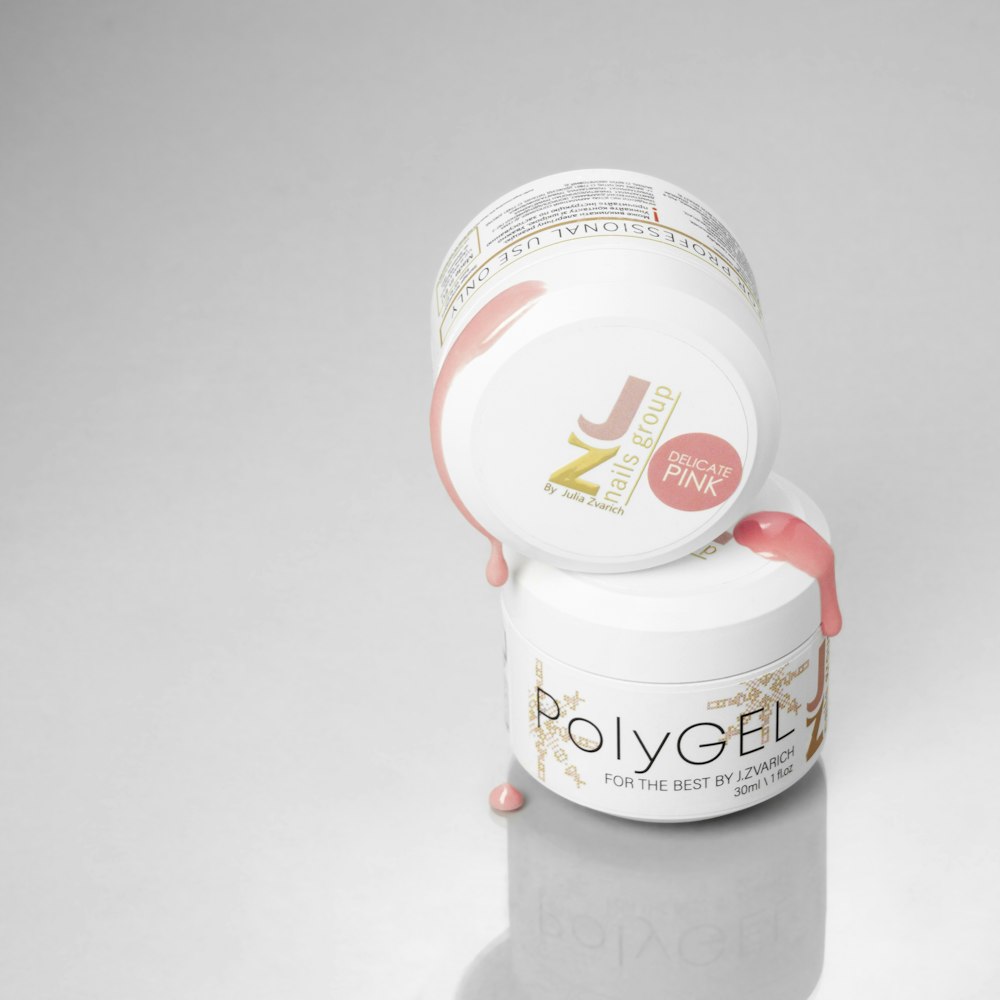 a jar of polygel on a white surface