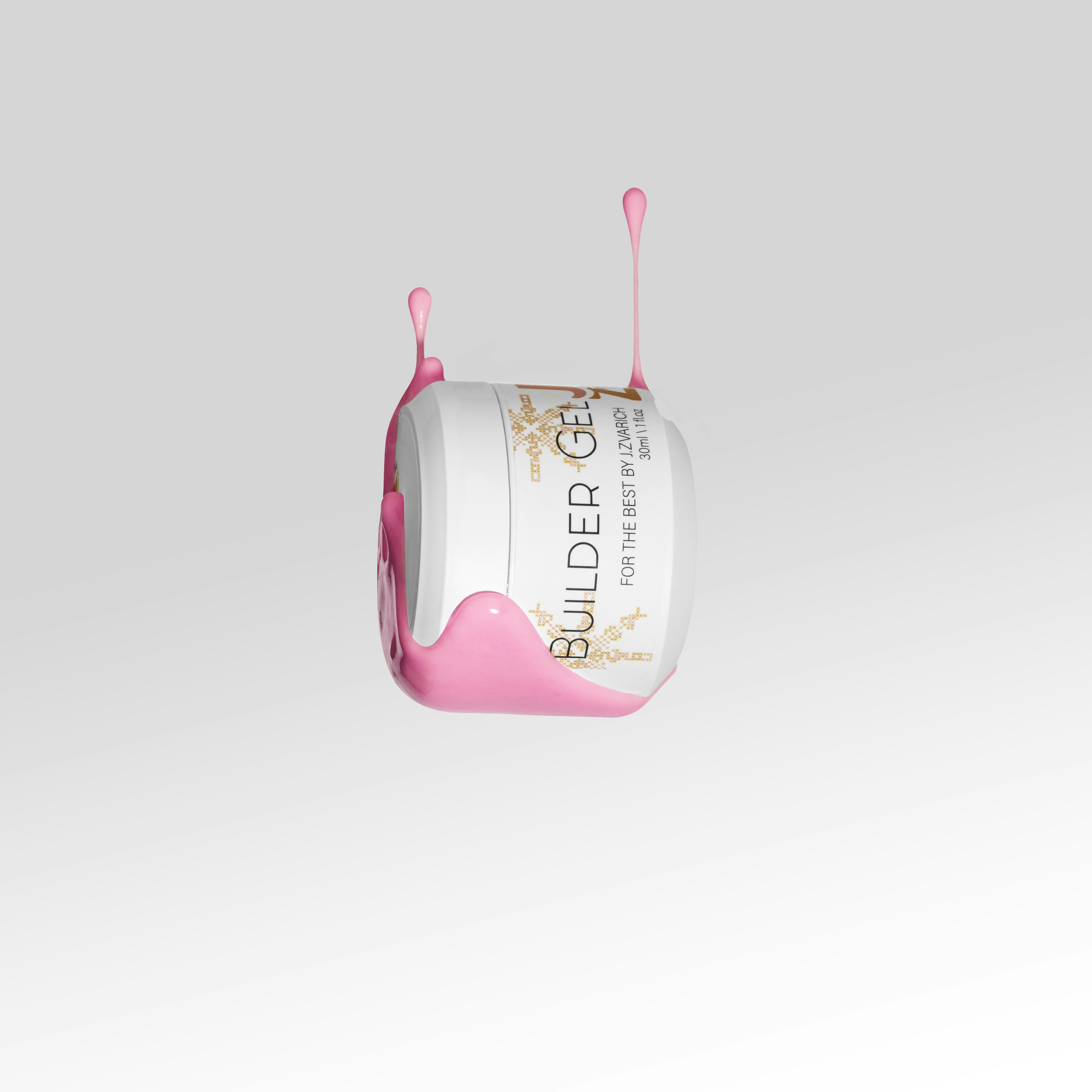 una taza de líquido rosado flotando en el aire