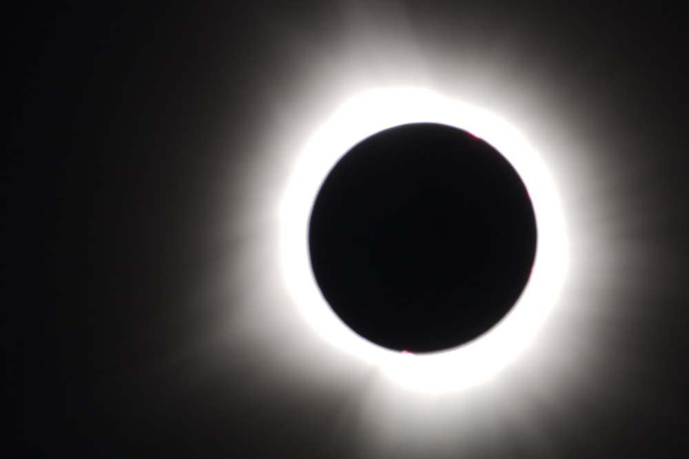 a solar eclipse is seen in the dark sky