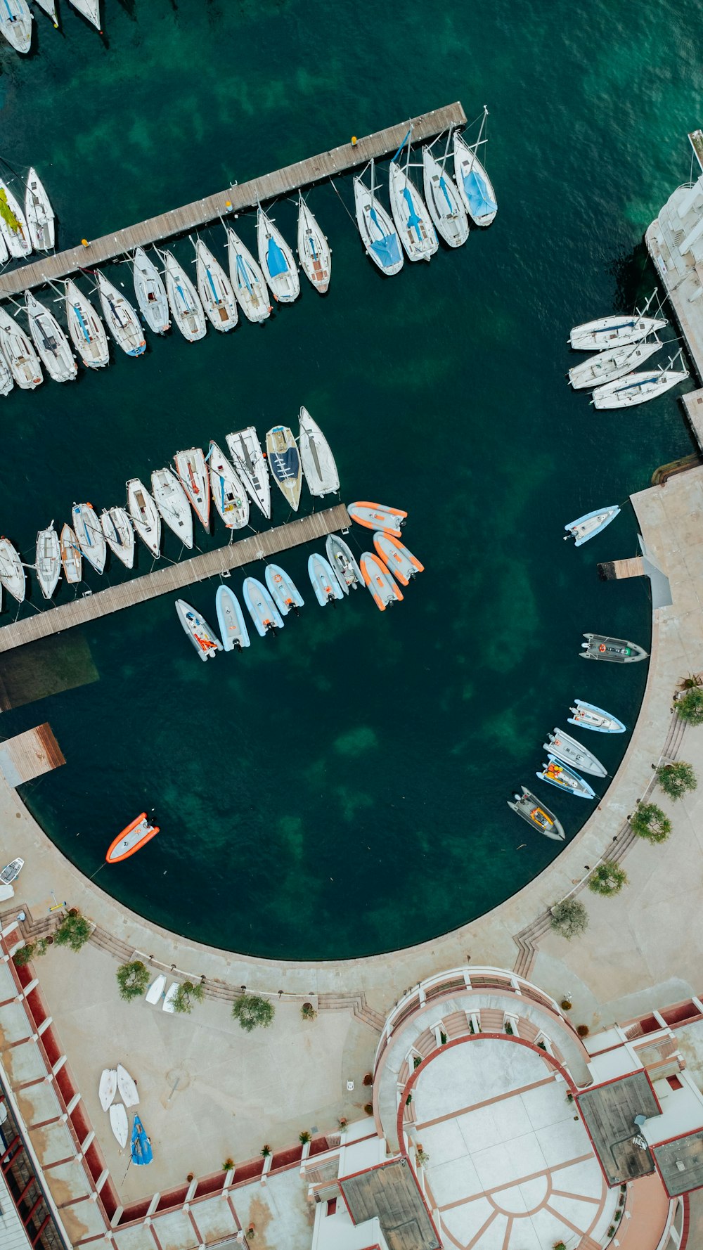 an aerial view of a marina with many boats