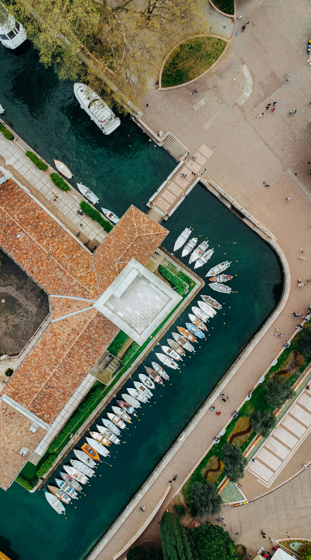 an aerial view of a marina with many boats