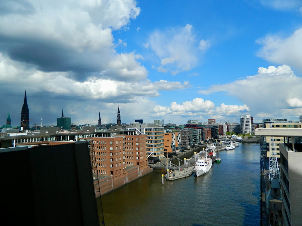 a river running through a city next to tall buildings