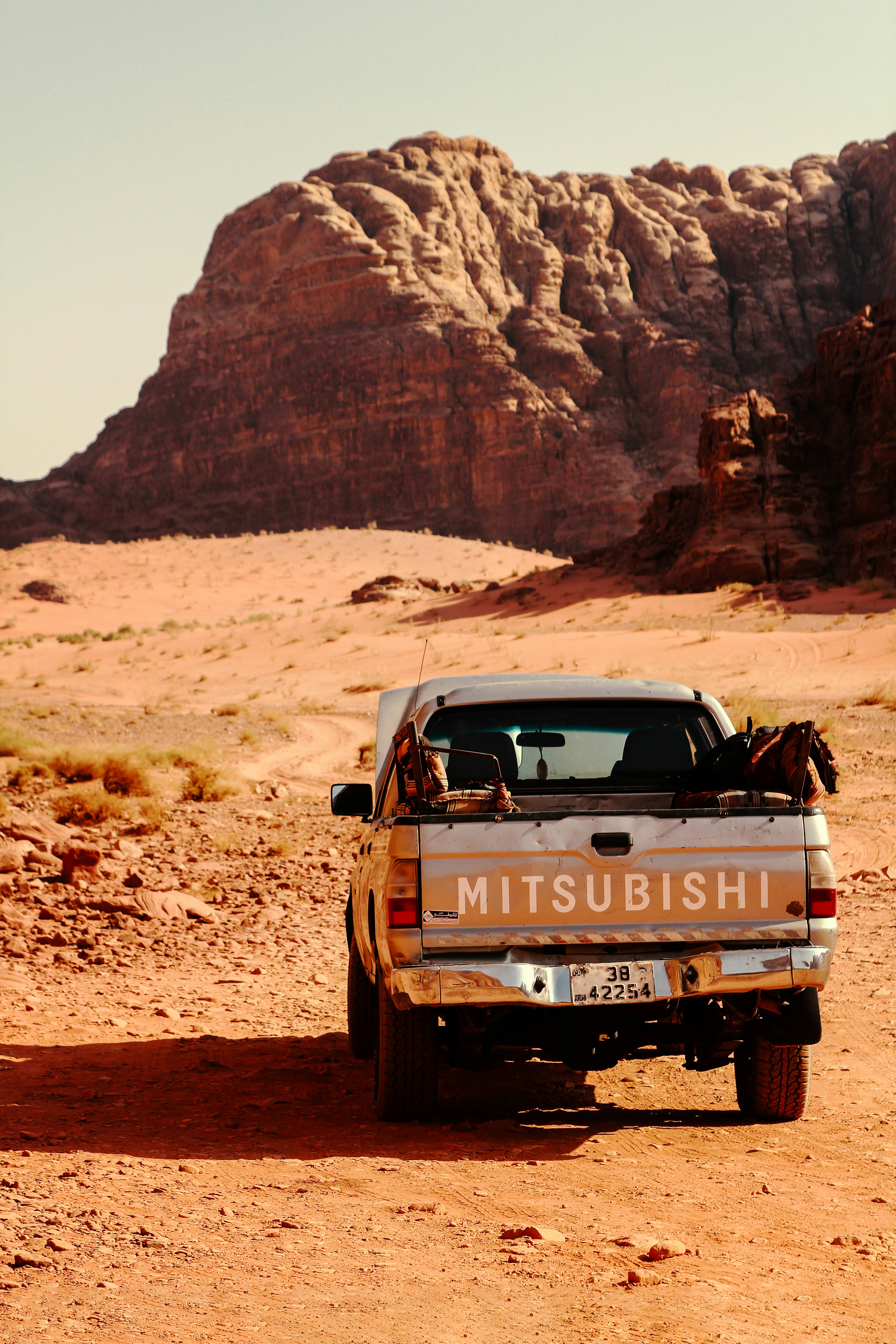 a truck parked in the middle of a desert