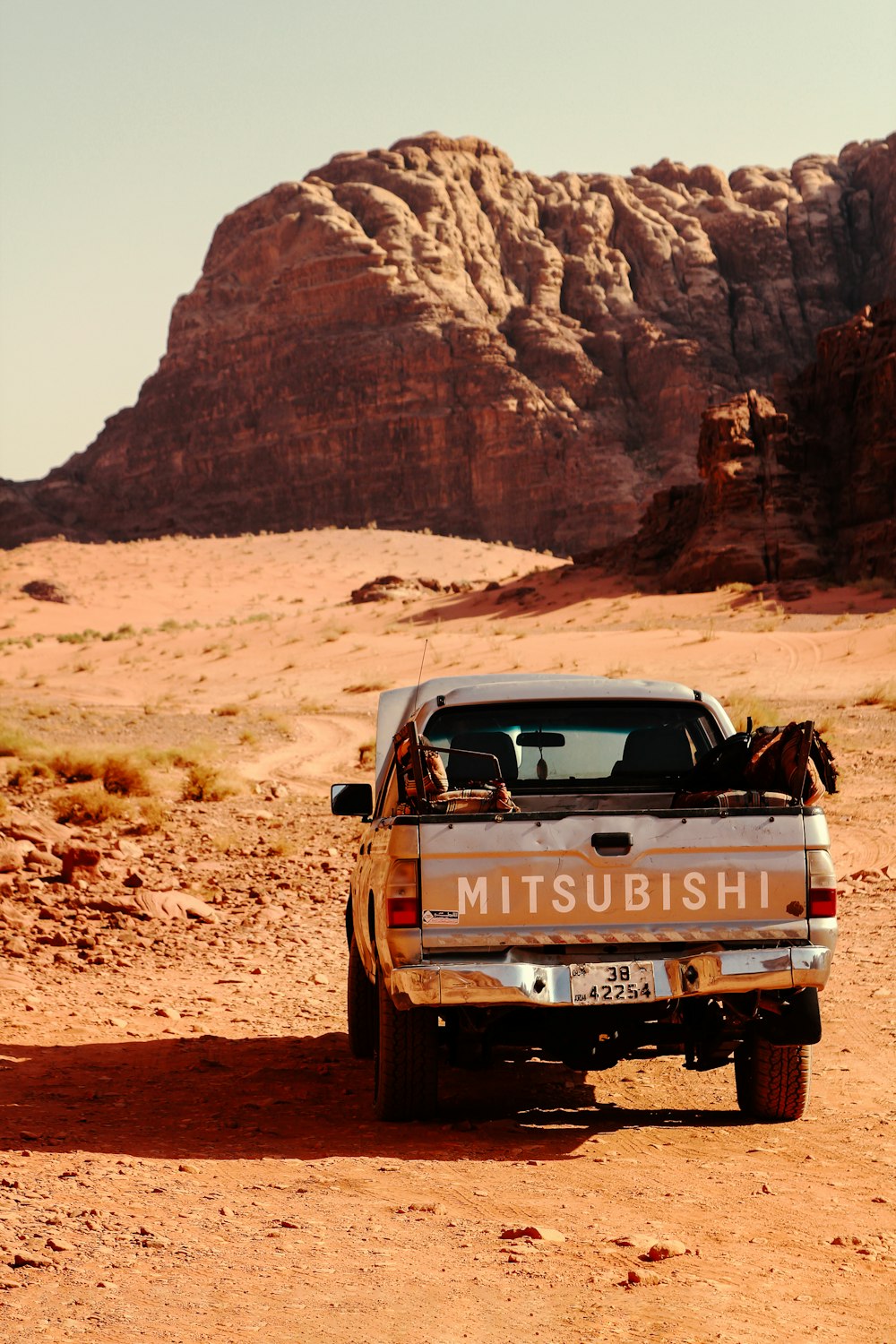 a truck parked in the middle of a desert