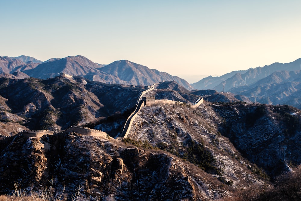 a view of the great wall of china from the top of a mountain