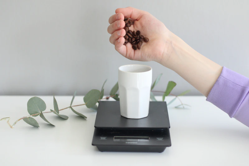 Coffee beans weighed on a precision scale before grinding
