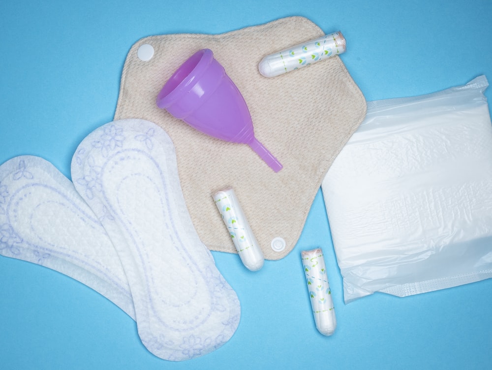 the contents of a diaper laid out on a blue surface