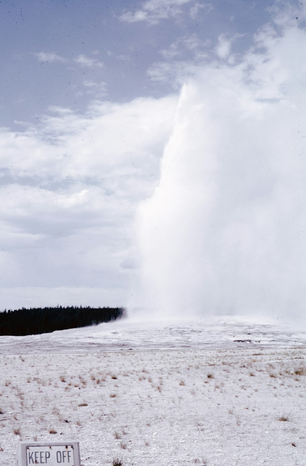 a large geyser spewing out water into the sky