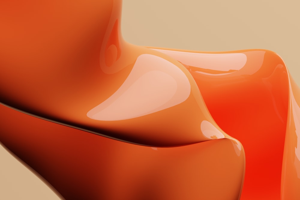 a close up of an orange vase with a white background