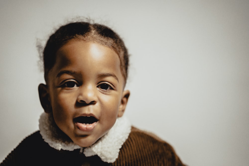 a young child with a surprised look on his face