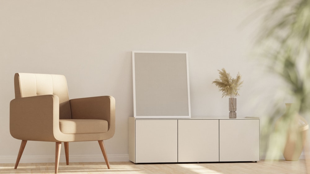 a chair sitting next to a white cabinet in a room