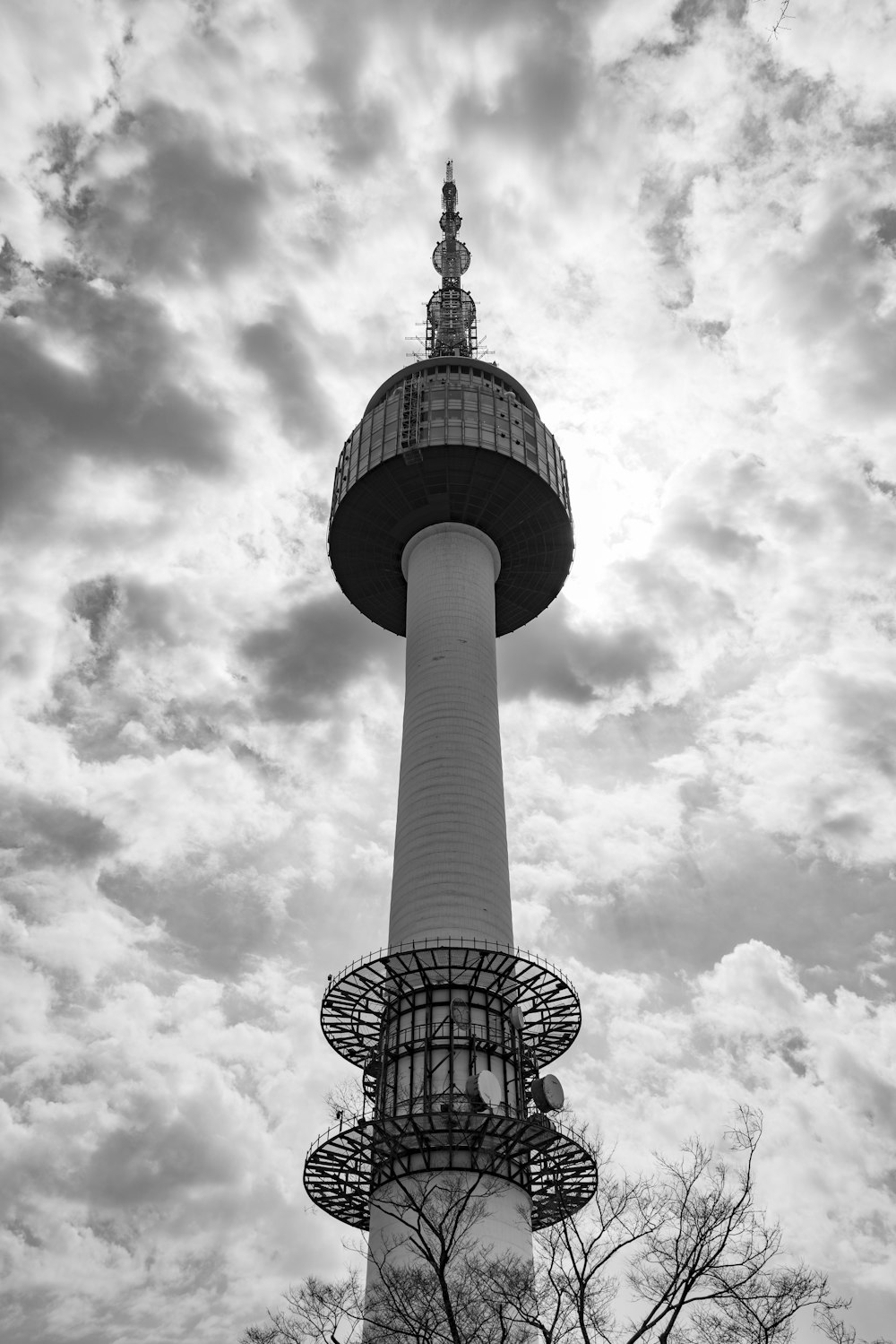 a black and white photo of a tall tower