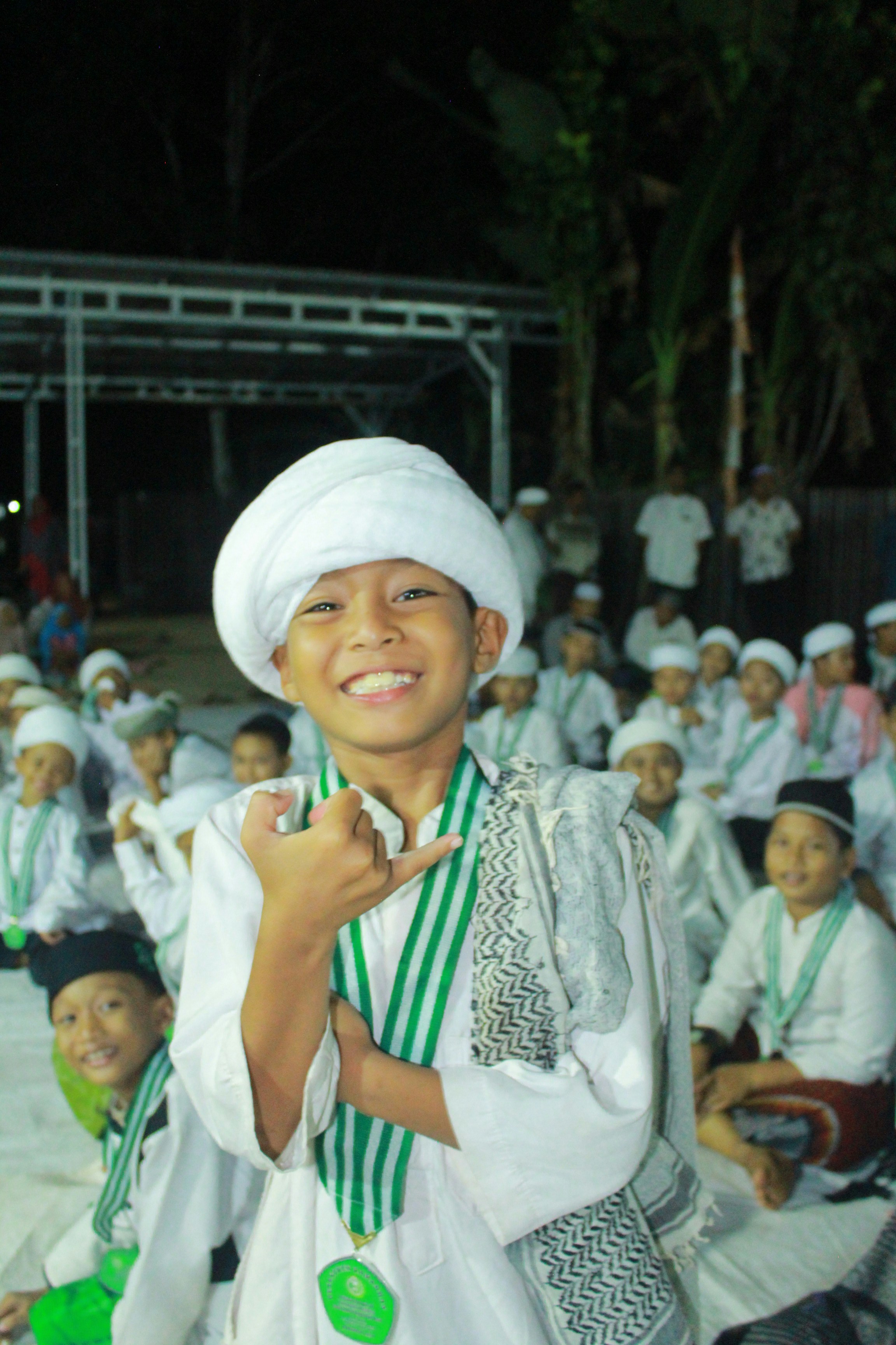 a group of young men sitting next to each other