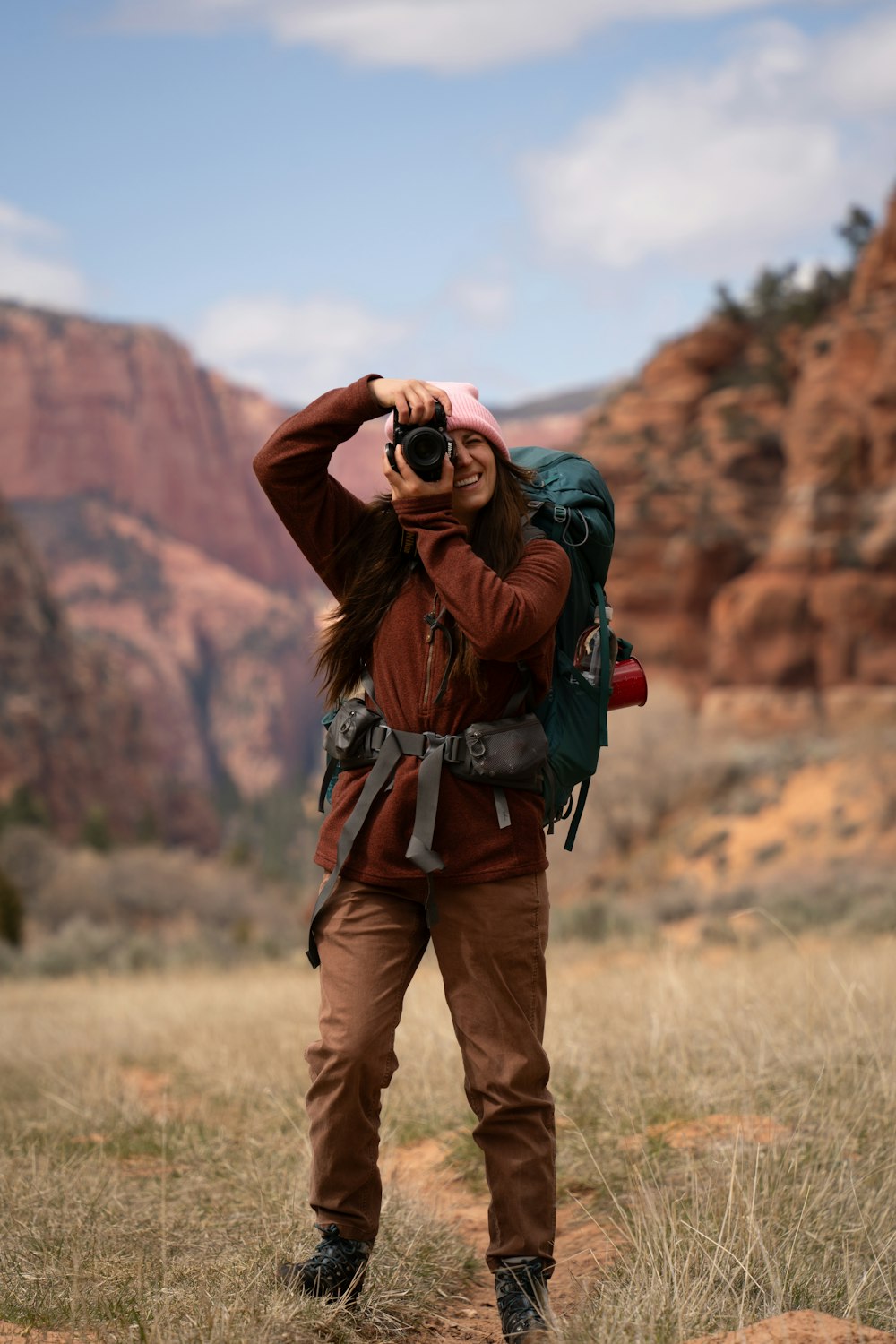 a woman taking a picture with a camera