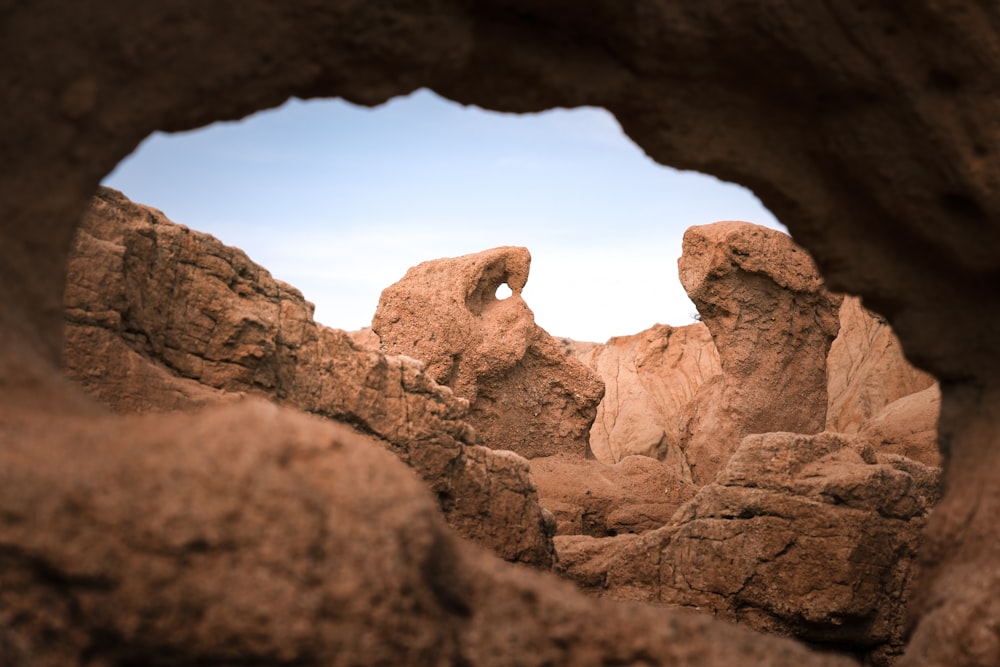 a rock formation with a hole in the middle